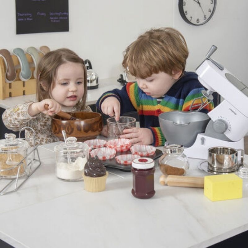 Front view of two children playing at the TTS Modern Living Breakfast Bar Island, demonstrating collaborative dramatic play in a classroom setting