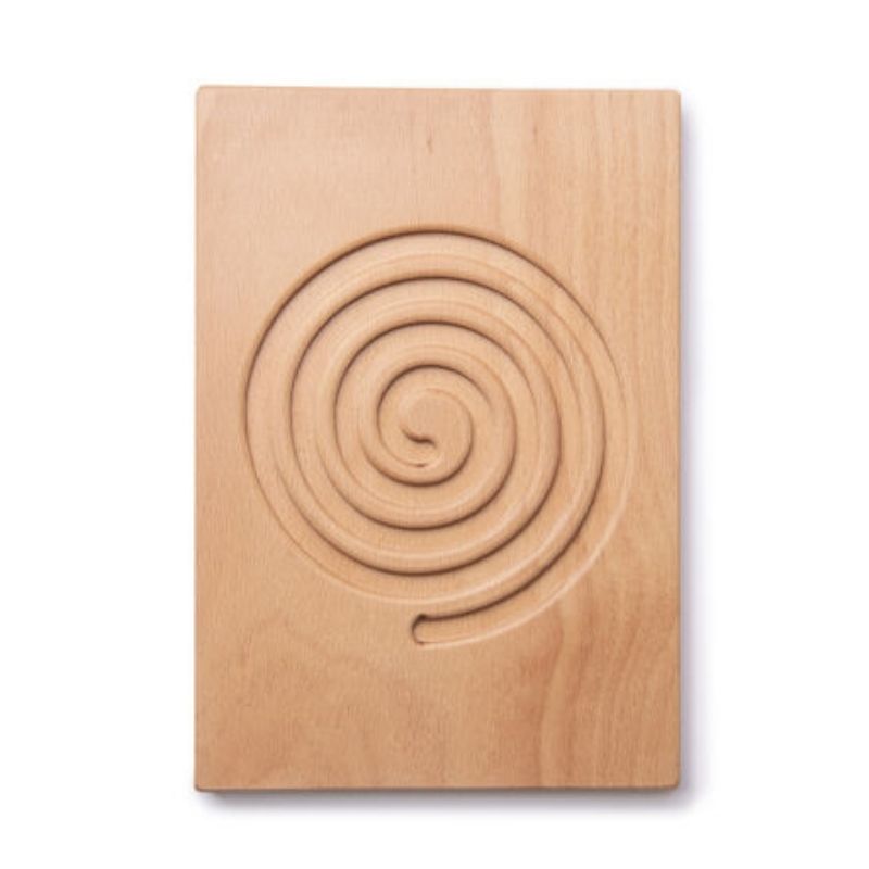 Child's hand tracing an engraved pattern on TTS Breathing and Mindfulness Board to practise calm, focused breathing and emotional regulation