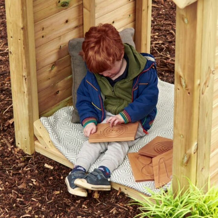 Side profile of TTS beech wood breathing board showing engraved depth and compact size suited to small hands and portable calm down kits