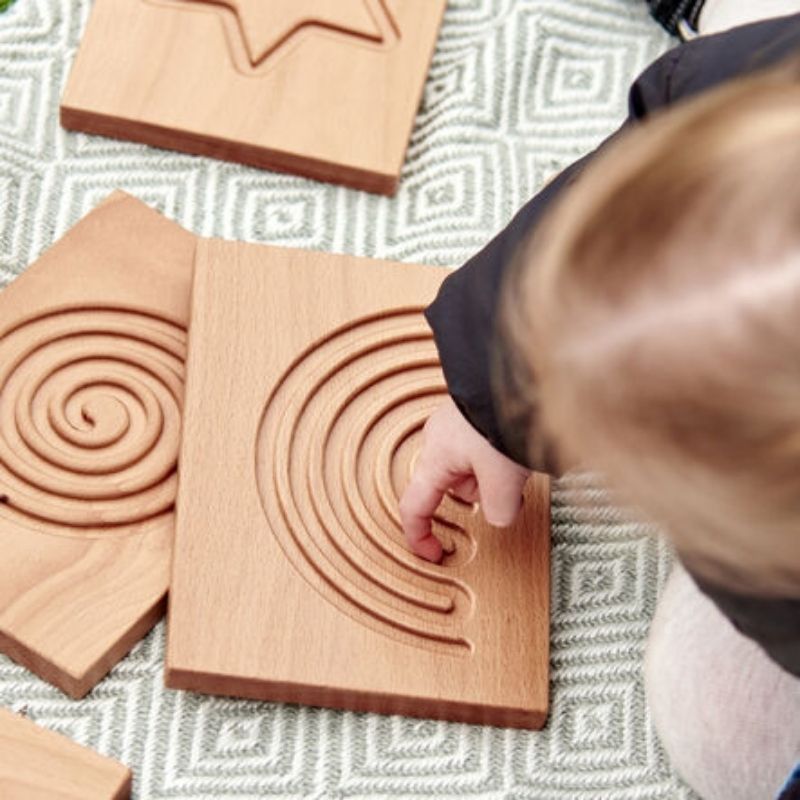 Close-up of engraved finger-trace pattern on TTS Breathing and Mindfulness Board, a wooden self-regulation tool for guided breathing exercises