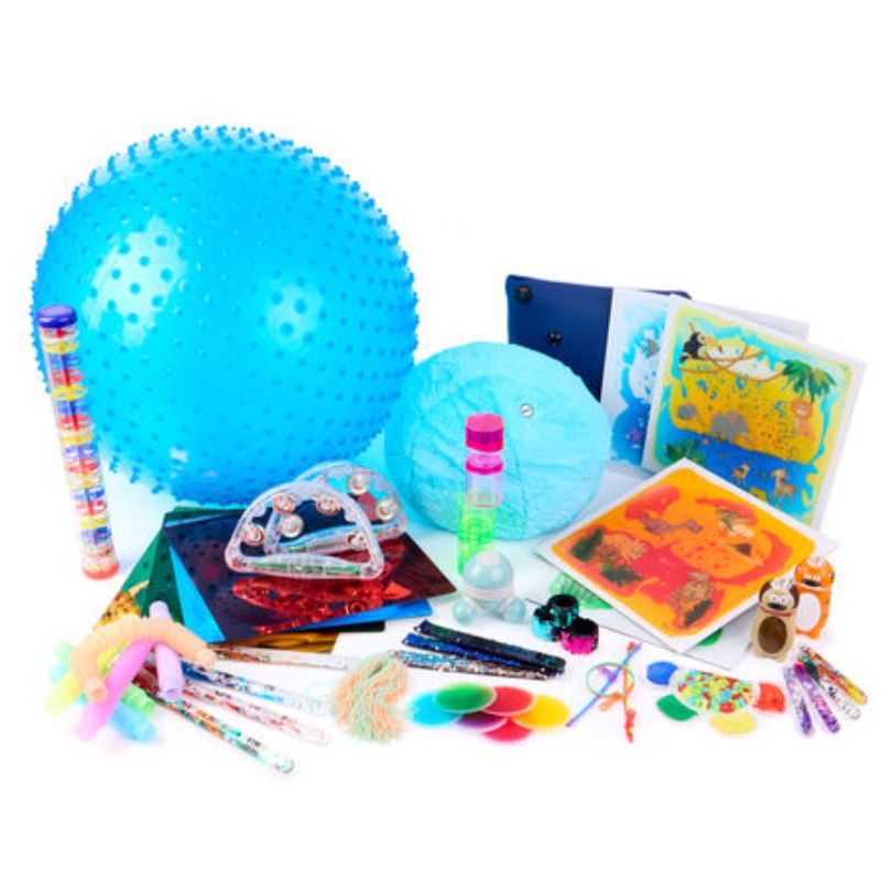 TTS Complete Sensory and Stimulation Kit laid out in full, including a spiky ball, fluffy cushion, rainmaker, light-up tambourines, mirror panels, liquid tiles and sensory wands