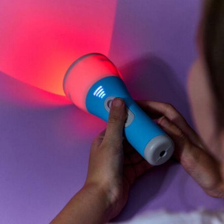 Close-up of TTS Colour Changing Easi-Torch emitting red LED light, showing the crisp beam for shadow play and colour exploration