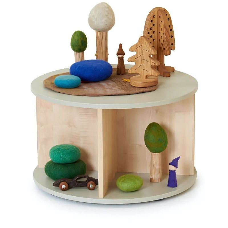 TTS Elements Toddler Round Location Station styled with toys and books, showing the round early years storage unit in an early childhood classroom setting