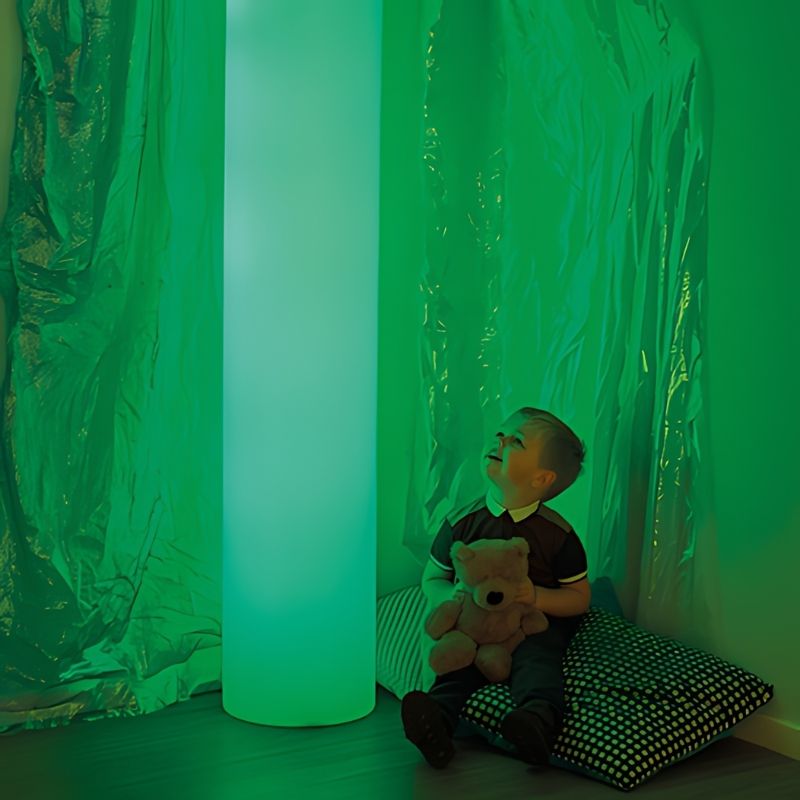 TTS Giant Sensory Glow Cylinder Tube illuminated in green LED light, a tall visual sensory light for sensory rooms and calm corners