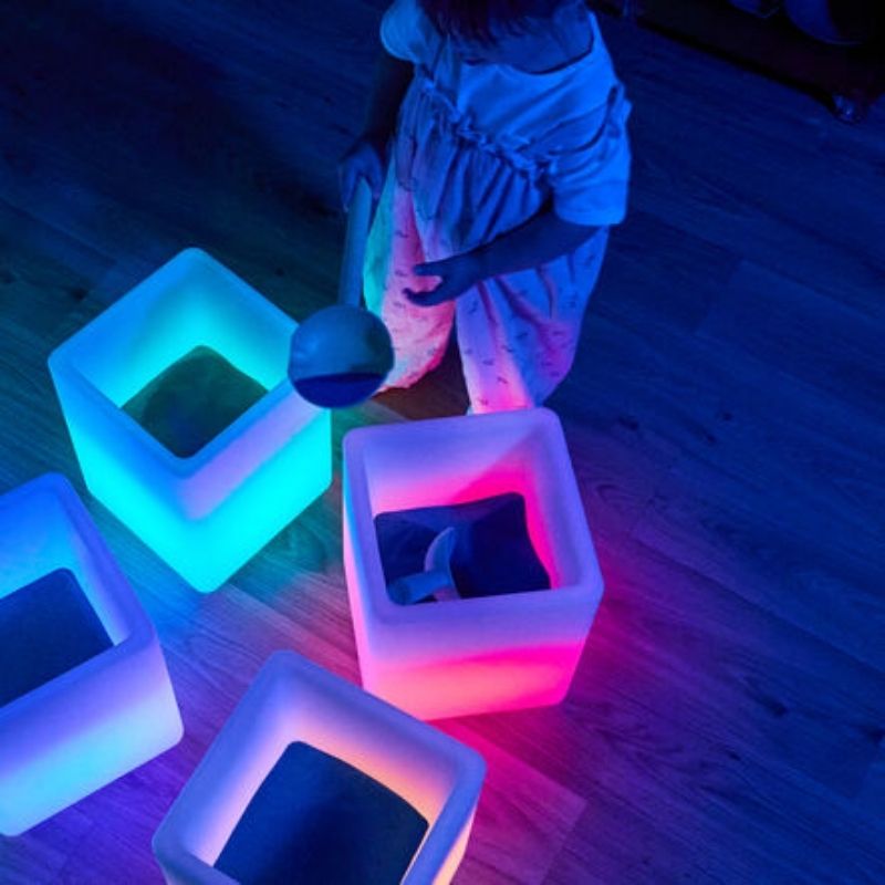 TTS Messy Play Glow Cube displaying colour-changing LED lighting with remote control, ideal for sensory rooms and early years classrooms