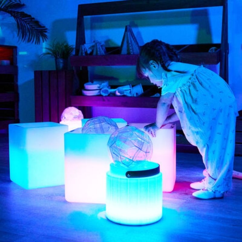 TTS Messy Play Glow Cube with USB charging cable, showing the rechargeable design that provides up to 8 hours of use from a single charge