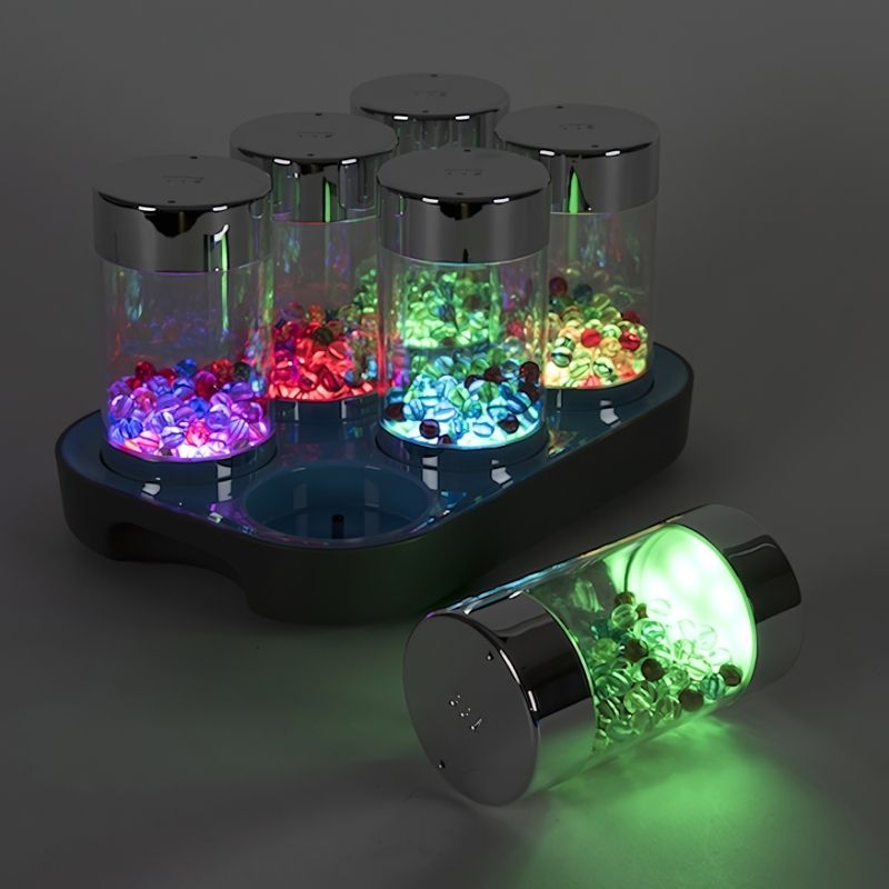 TTS Illuminated Glow Roller Shakers set of 6 in a landscape arrangement with one roller separated, showing the LED glow sensory light effect