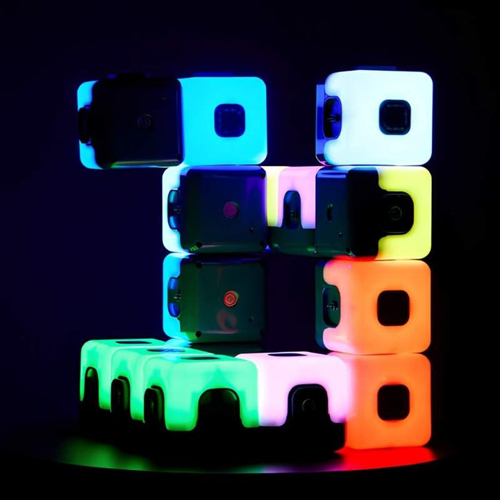 TTS Glow Sequencing Cubes stacked and magnetically connected, displaying the full multi-colour glow range including blue, cyan, yellow, orange and white