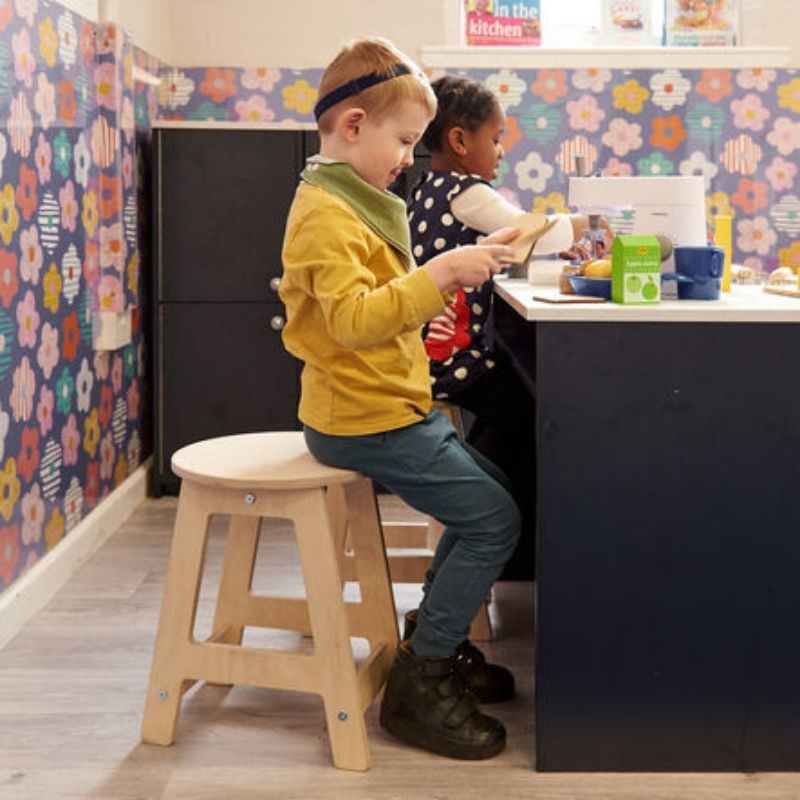 Two children engaged in pretend play with TTS Modern Living kitchen stools, illustrating the pack-of-two configuration for paired imaginative play