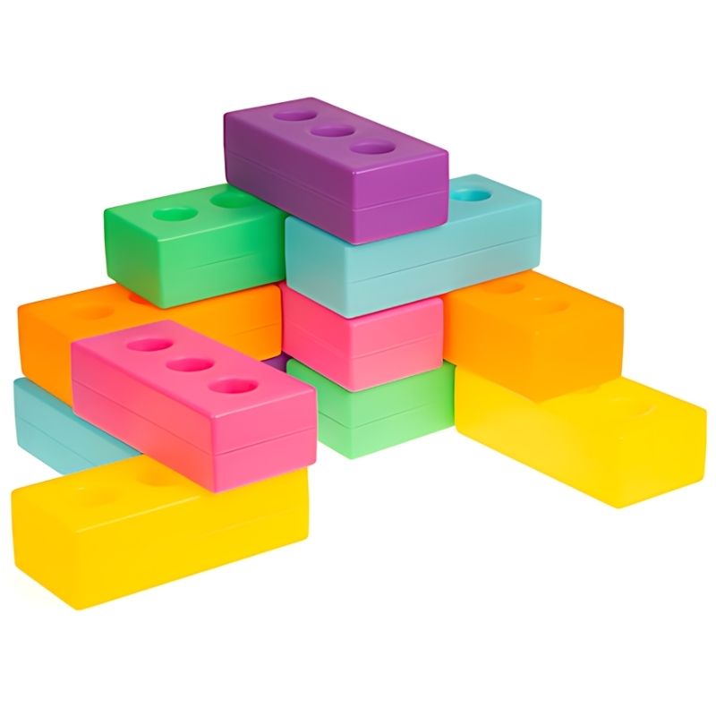 TTS Light Up Glow Construction Bricks full set of 12 laid out cleanly, showing all six colours: blue, green, yellow, orange, pink, and purple