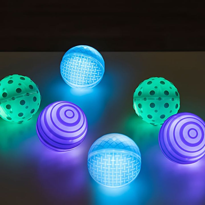 TTS Light Up Tactile Glow Spheres set of 6 rechargeable sensory balls with raised silicone texture patterns, a tactile sensory toy for early years and therapy settings
