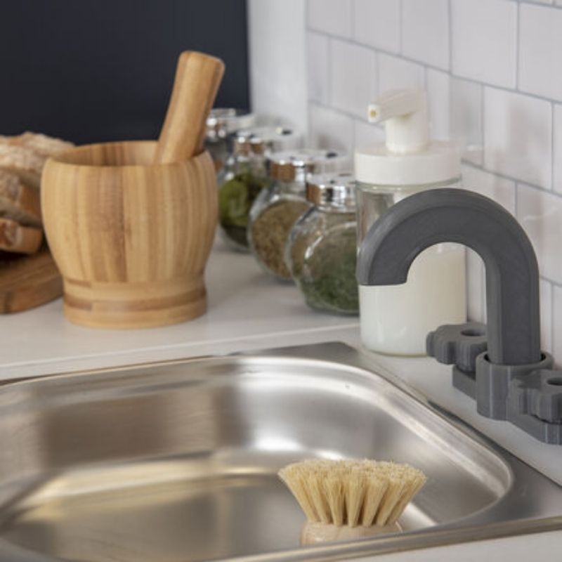 TTS Modern Living Sink and Hob Unit styled in a classroom home corner alongside other Modern Living Collection units, showing the modular role play kitchen layout