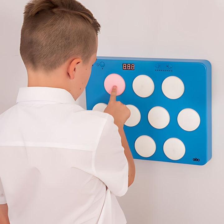 Close-up of the TTS Light Up Reaction Wall Game showing illuminated buttons and score display during the 60-second timed challenge mode, designed to build reaction speed and visual processing