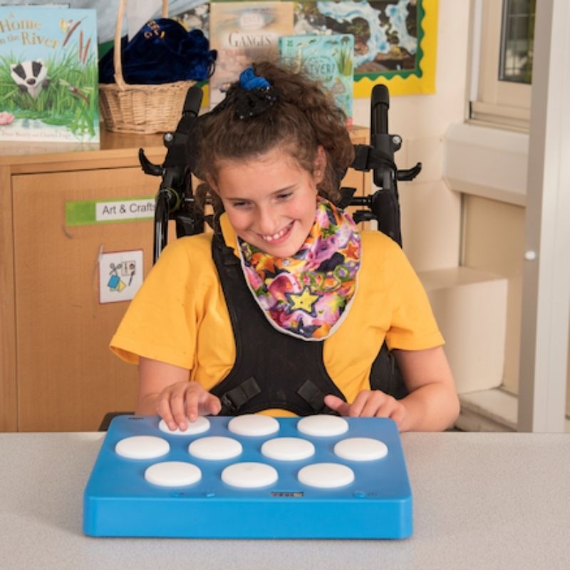 TTS Portable Reaction Wall Game mounted on a wall with a child playing in a standing position, supporting gross motor development and active learning in school and therapy environments