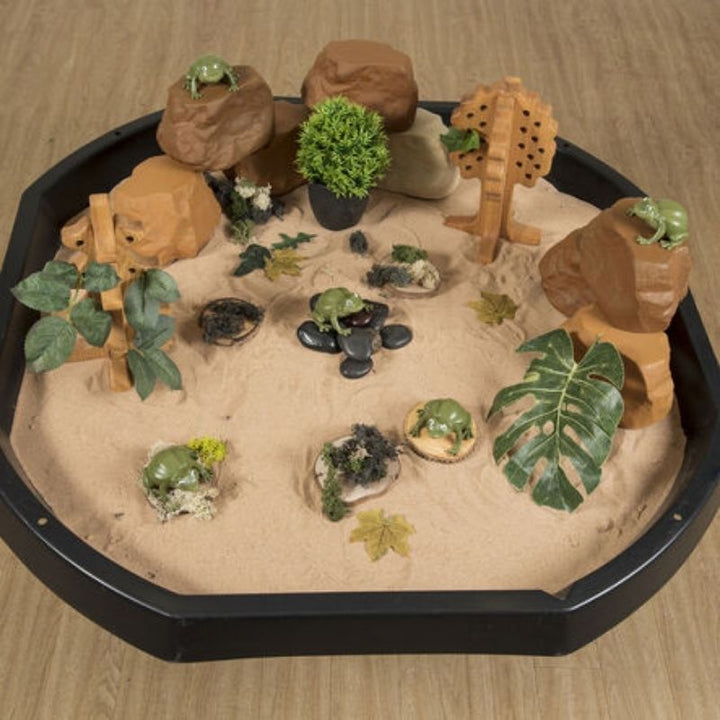 TTS Recordable Talking Frogs placed in a sand tray, showing their versatility for outdoor and messy play language activities
