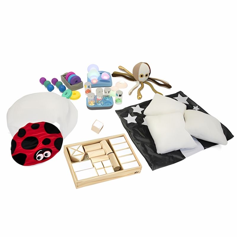 Full layout of all 14 pieces in the TTS Sensory Retreat Collection including pop-up tent, vibrating cushion, glow pebbles, and lap weight