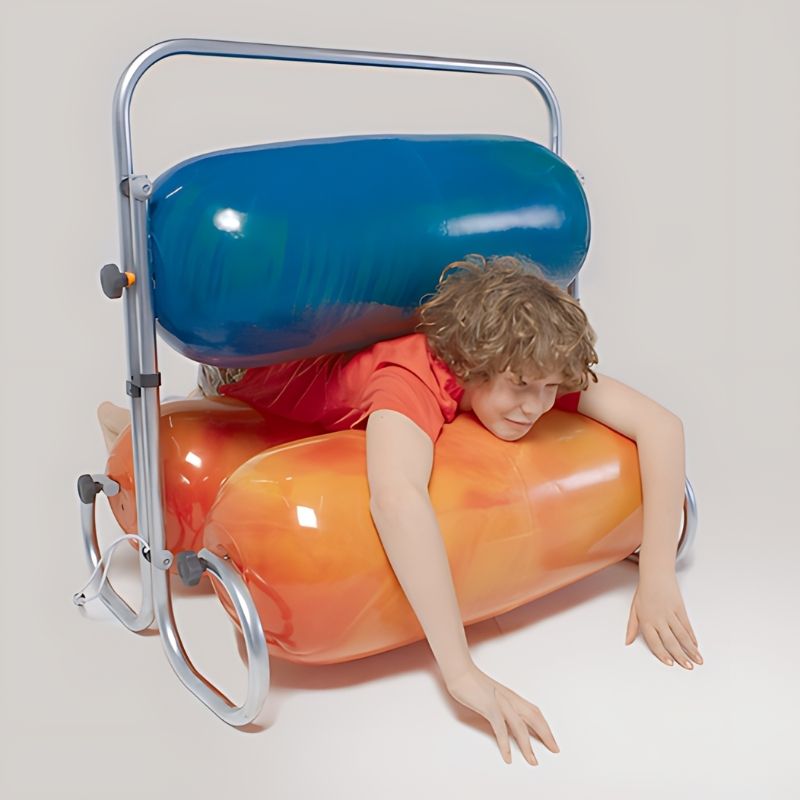 TTS Sensory Squeeze Machine with child crawling through padded rollers, a deep pressure proprioceptive tool for sensory integration and calm