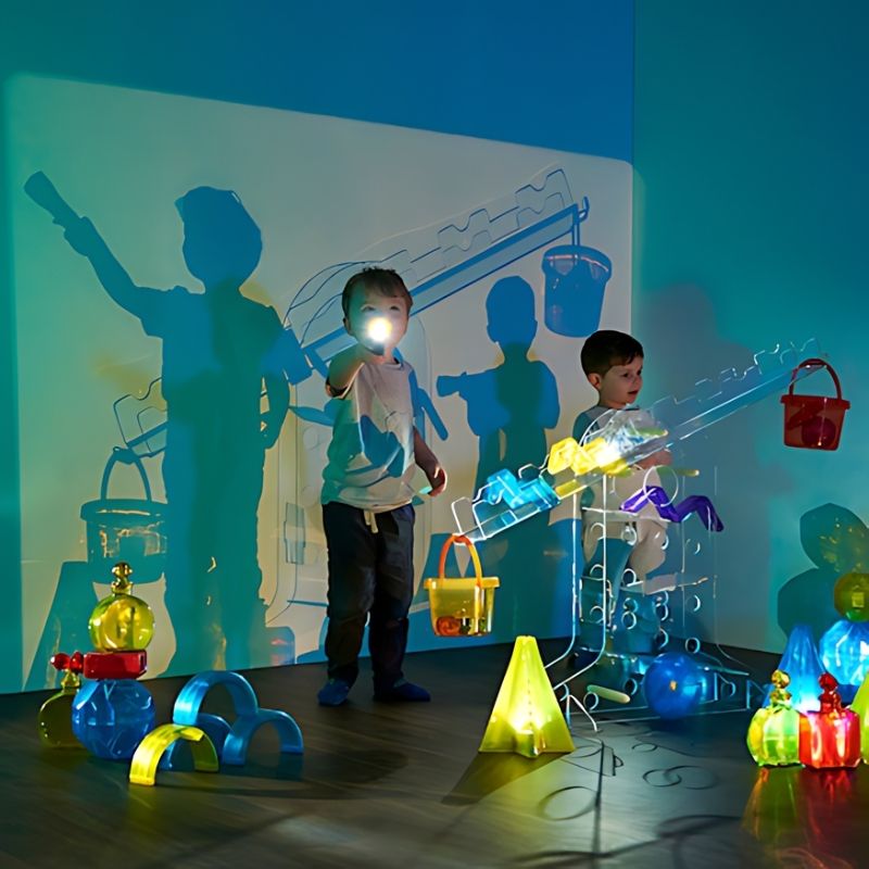 Two boys using the TTS STEAM Discovery Centre together, demonstrating the collaborative STEAM exploration the large-format acrylic station supports