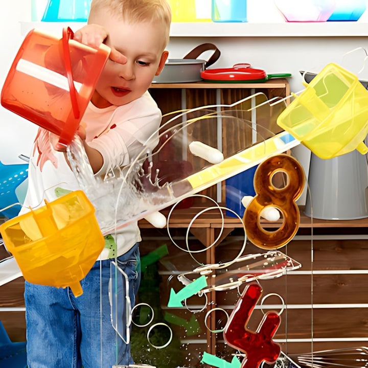 Child using a bucket with the TTS STEAM Discovery Centre balance scale, exploring weight and mass concepts through hands-on STEAM play