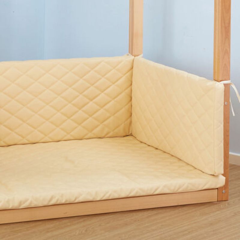 Close-up of the quilted cream seat and back cushions tied into the TTS Super Seat Indoor Wooden Den Structure, creating a soft, cozy calm corner or reading nook