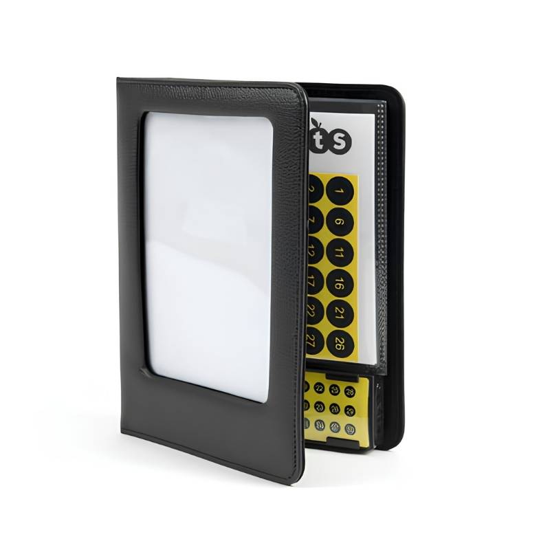 TTS A5 Talking Photo Album standing open to show the front cover photo window, ring binder pages, and the yellow 30-button recordable unit with numbered page sticker sheet