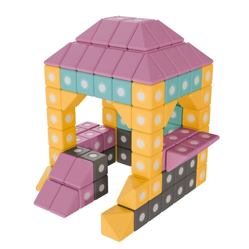 TUKI BIG Magnetic Blocks Builder 12 arranged into a house figure, demonstrating the open-ended 3D construction and early engineering spatial reasoning the 12-piece large-format magnetic foam block set enables