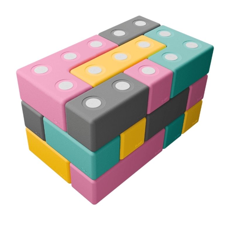 TUKI BIG Magnetic Blocks Builder 26 clean landscape view showing all 26 large 10cm magnetic EVA foam blocks in 7 Signature shapes including triangles, the EN71-certified floor building construction set for children and therapy settings across North America