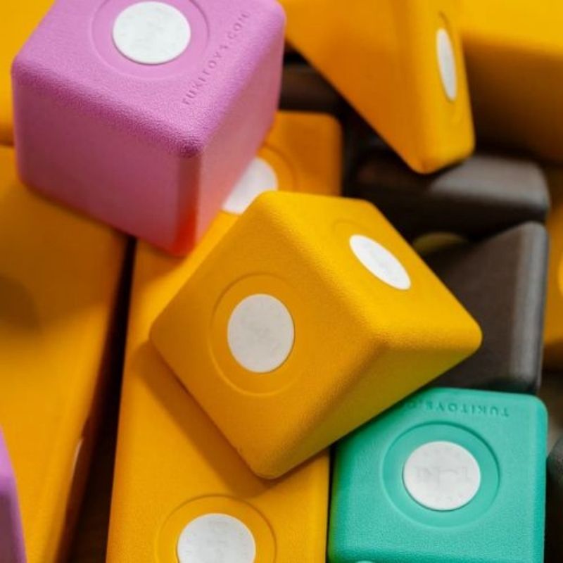Close-up of TUKI Big Magnetic Foam Blocks Smart 240 showing EVA foam block texture, Smart line shape detail, and sealed rotating neodymium magnet capsule