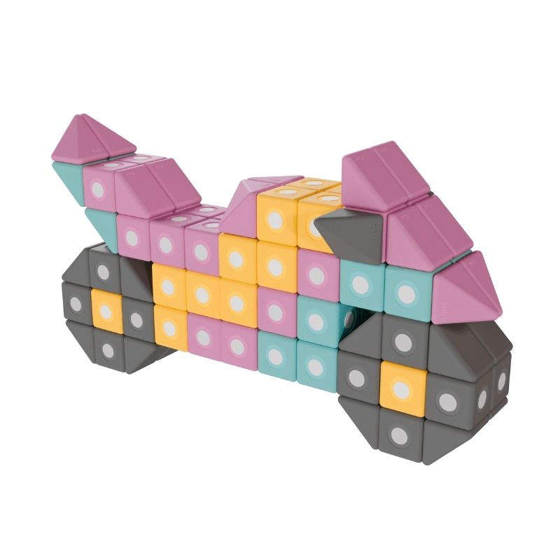 TUKI BIG Smart Magnetic Blocks Smart 75 arranged into a motorbike figure, demonstrating the complex structural construction that 75 large-format magnetic foam blocks in 3 Smart shapes including approximately 25 pyramids enables for group floor building