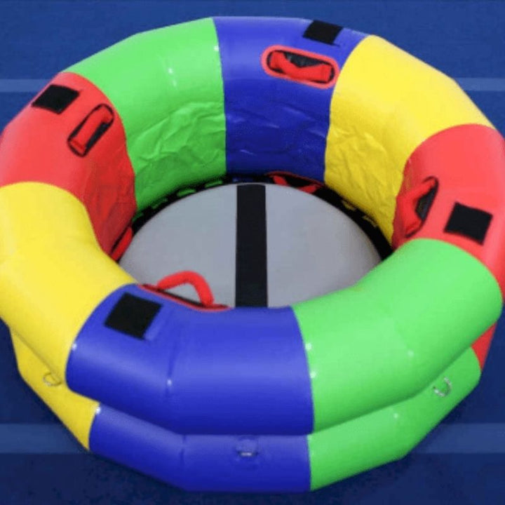 Overhead view of the Tumbl Trak Fitness Wheel against a blue background showing the Velcro squares on the top perimeter and D-ring positions for accessory and Hammock attachment