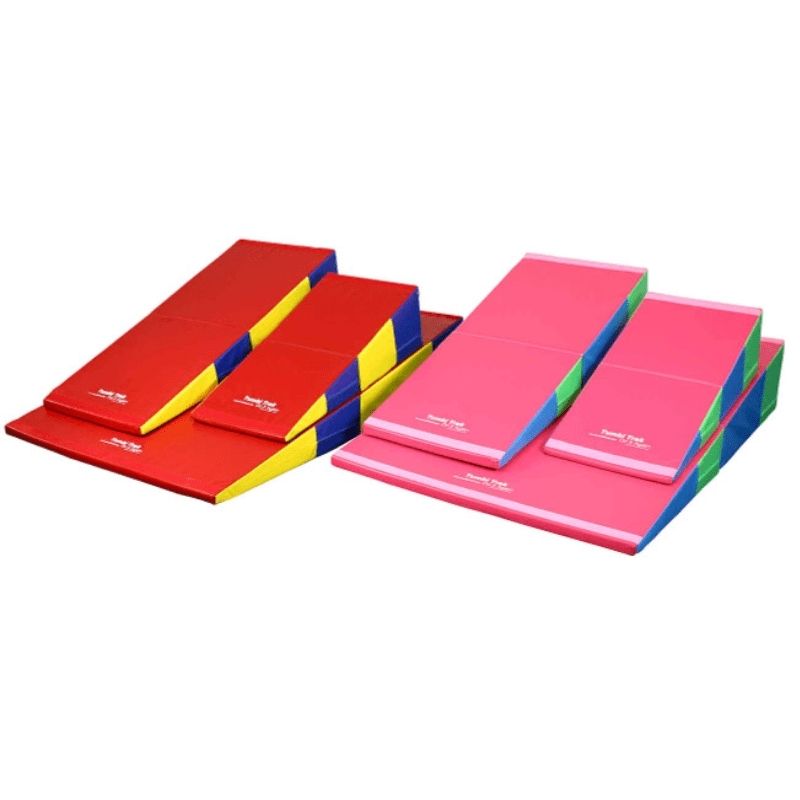 Tumbl Trak Folding Incline Mat shown in Bright Pastel Rainbow and Primary Rainbow colour variants, a cheese mat and wedge mat for gymnastics, sensory play, and motor skill development