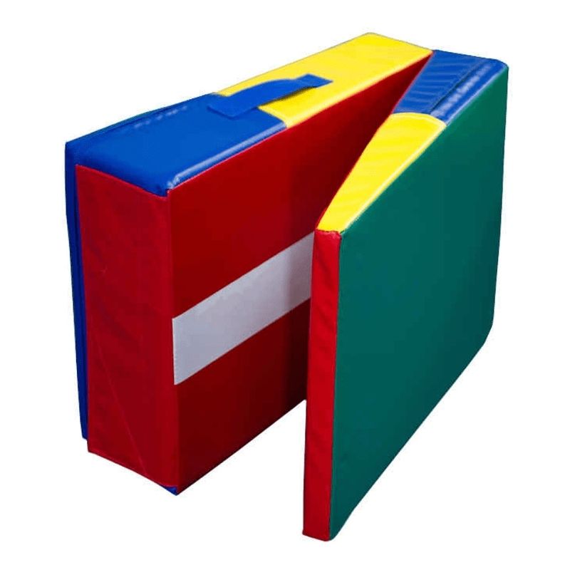 Tumbl Trak Folding Mini Ramp in folded standing position a stable block with Velcro flap secured, showing the compact block shape 