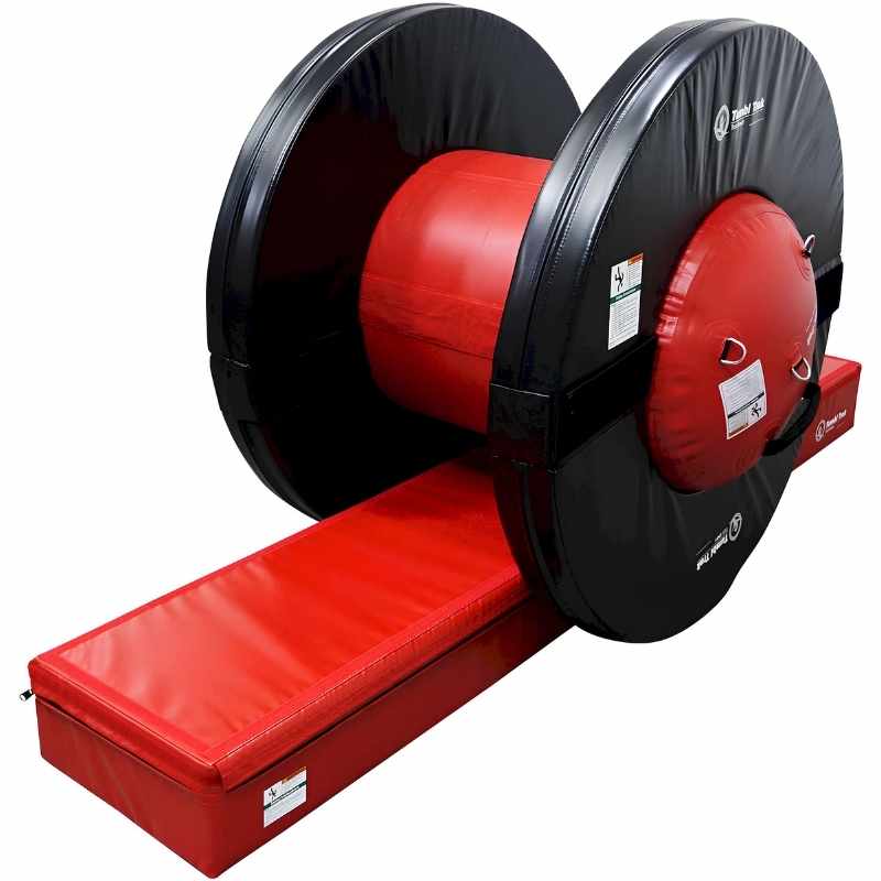 Tumbl Trak Orbiter Bundle 2 fully assembled in red and black, showing the Air Barrel housed between two firm foam rings with a red Booster Block in position for gymnastics tumbling training