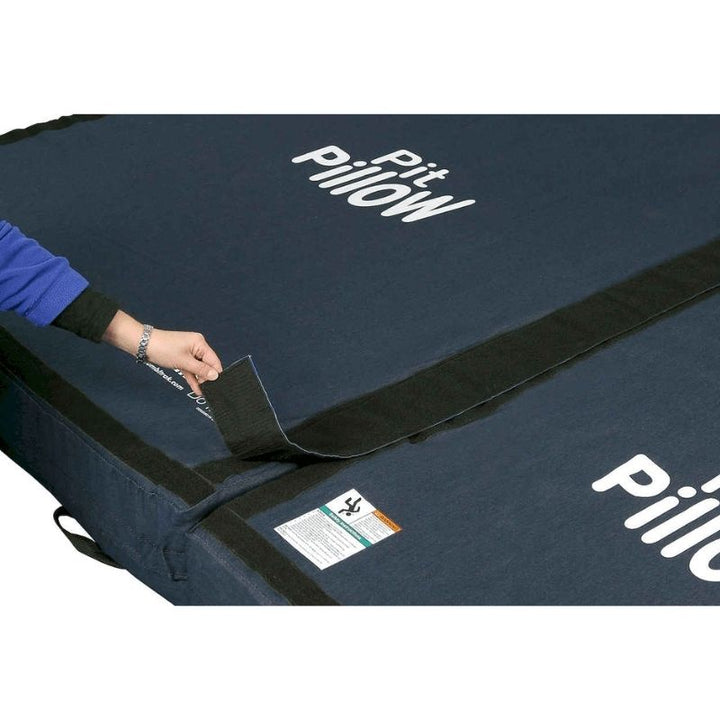 Tumbl Trak Pit Pillow showing the hook and loop Velcro fasteners on all four sides that allow multiple pit pillows to be connected end-to-end, side-by-side, or stacked vertically, and compatibility with the Air Floor and Mama Bear