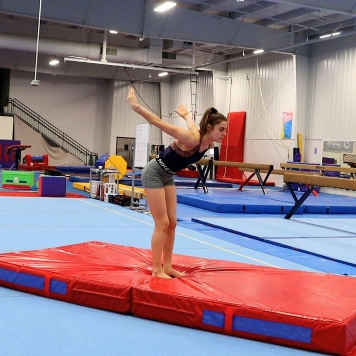 Girl actively landing on the Tumbl Trak Soft Mat, demonstrating the soft single-density foam cushioning that builds beginner confidence and supports therapeutic landing activities for children of all abilities