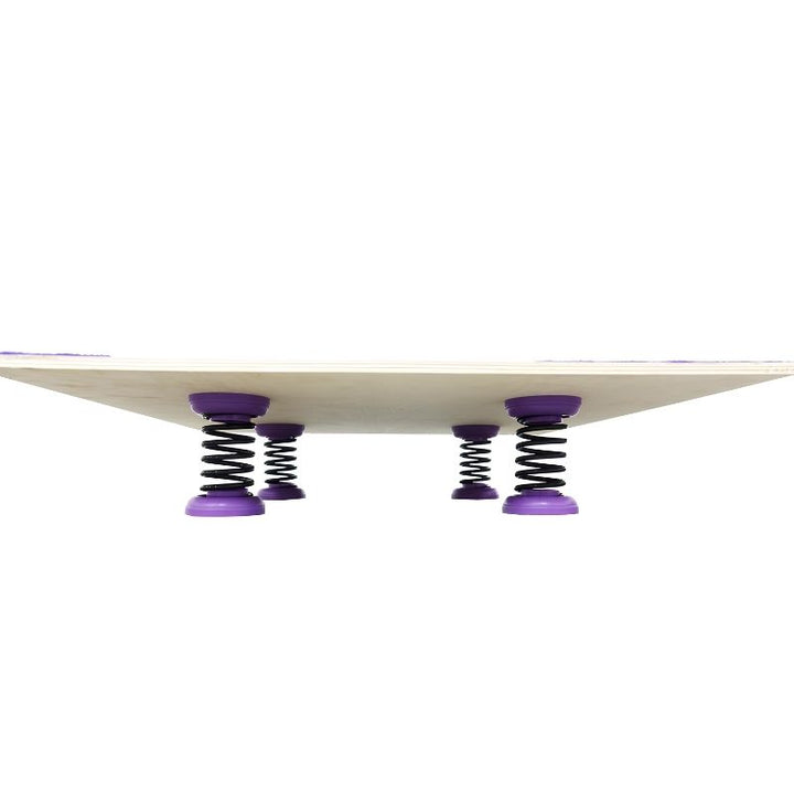 Side profile of a Tumbl Trak semi-assembled spring floor panel showing Baltic Birch plywood elevated on black high-carbon steel springs with purple caps, illustrating the 5-1/4 inch floor height
