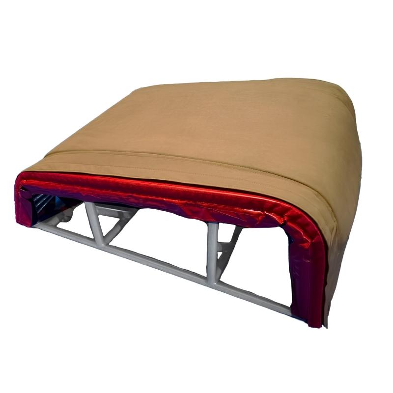Tumbl Trak T-Trainer Cover PRO fitted over the T-Trainer showing the suede vault table surface and padded dome profile on the white frame, for gymnastics vault training