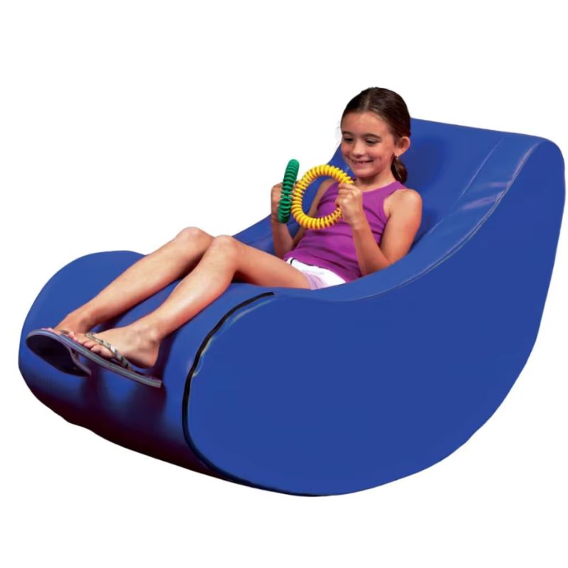 Child rocking in the TFH Vibroacoustic Jr. Therapy Chair, a compact vibroacoustic chair for kids providing calming proprioceptive input