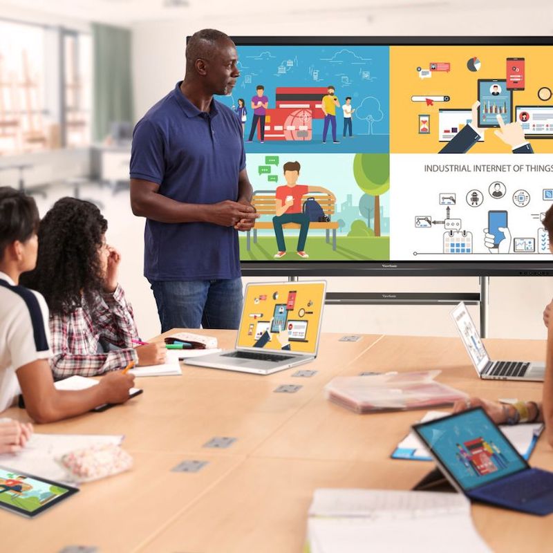 ViewSonic ViewBoard IFP50 Series interactive flat panel display mounted in a classroom, showing students engaged with collaborative learning