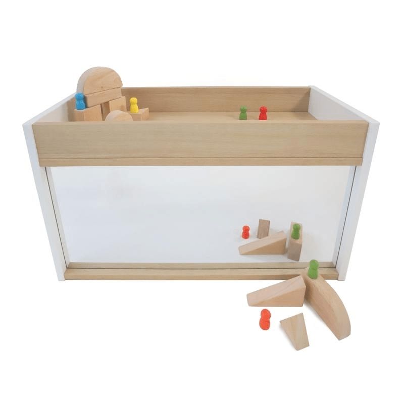 Second angle view of the Whitney Brothers elevatED I-See-Me Toddler Mirror Cabinet with toys, showing the full 31" wide shatterproof acrylic mirror and the 3-inch-deep top tray storage well