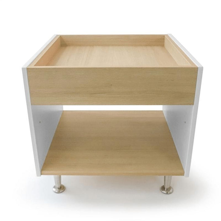 Clean product view of the Whitney Brothers elevatED Toddler Discovery Table WB1916 showing the full 26"x24.5"x24" white and textured white oak melamine elevatED Collection activity table