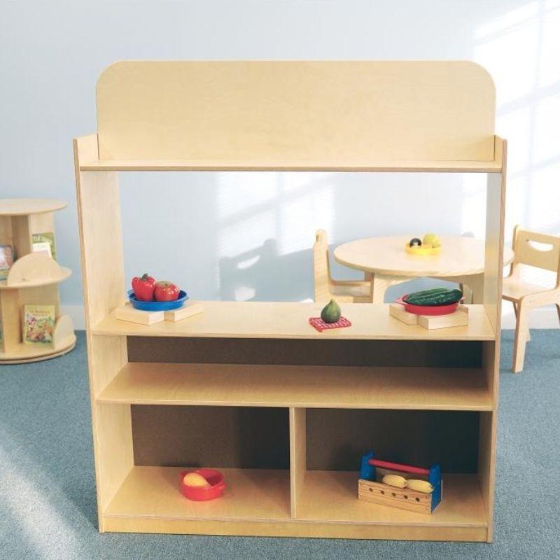 Rear view of the Whitney Brothers Imagination Station showing the two fixed back shelves with three storage compartments for dramatic play props and puppets