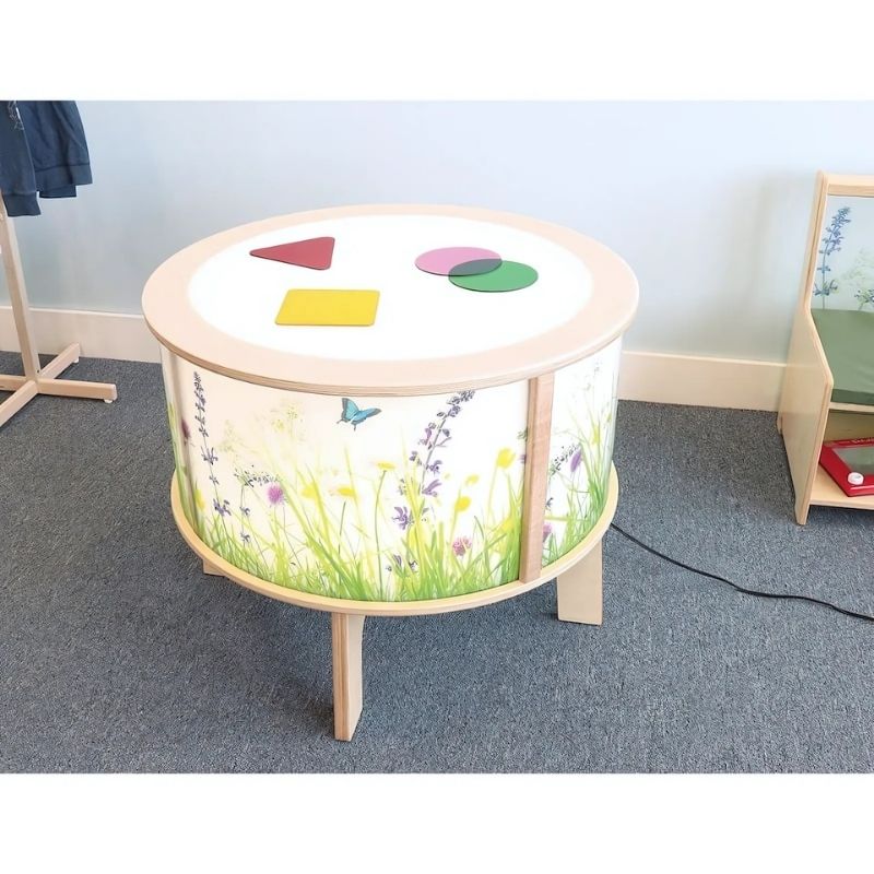 Top-down view of the Whitney Brothers Nature View Radiant LED Light Table showing the full round illuminated surface and the 360-degree accessibility of the cylinder design