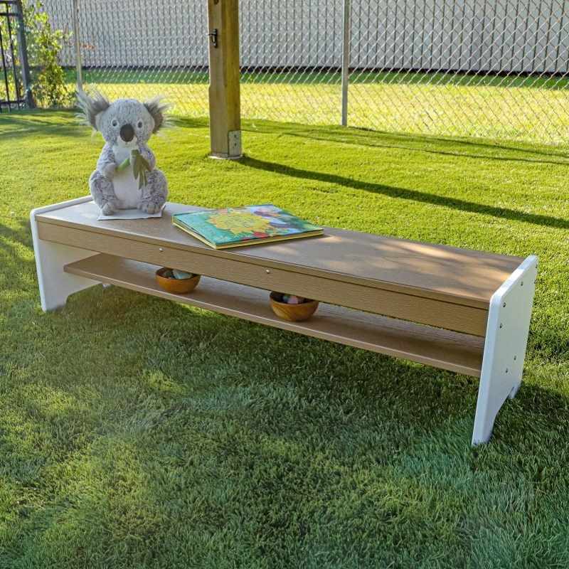 Whitney Brothers outdoorED Classroom Bench landscape view in outdoor learning setting showing weatherproof HDPE construction and child-scaled seating with built-in storage shelf