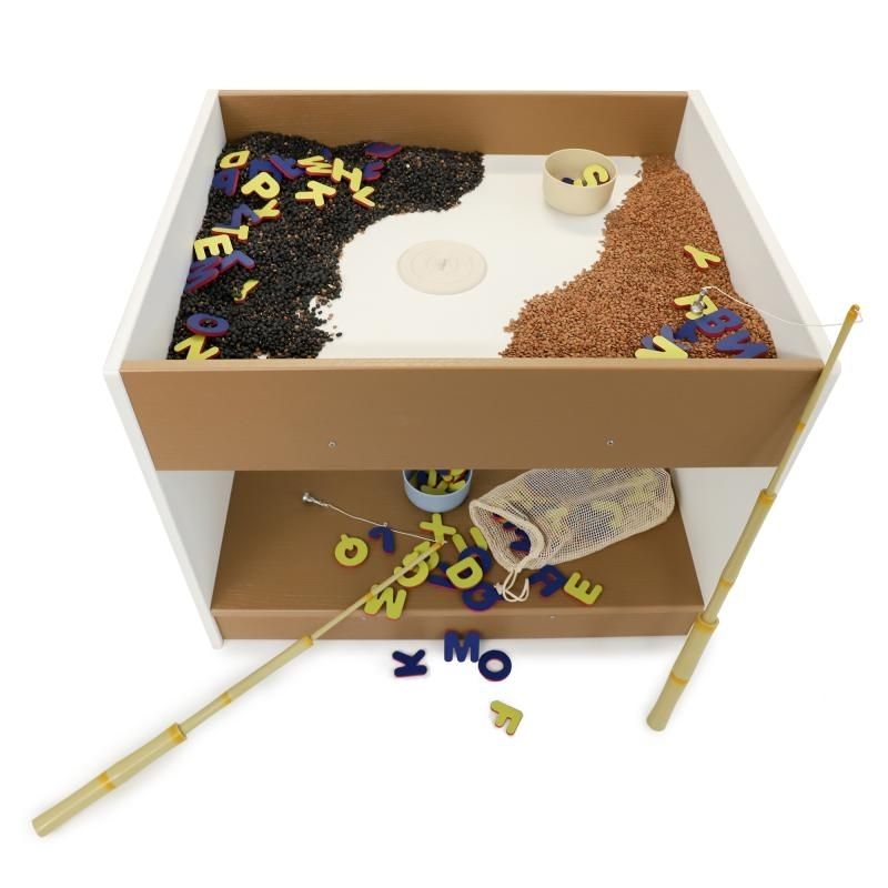Top view of the Whitney Brothers outdoorED Big and Wide Table showing reversible compartment top and two-tone woodgrain maple and polar white HDPE construction for outdoor sensory play