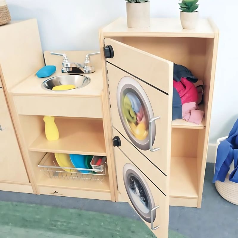 Whitney Brothers Let's Play Toddler Kitchen Ensemble Natural with open cabinet showing the doorless open-shelf design for easy toddler access to the stove and sink units