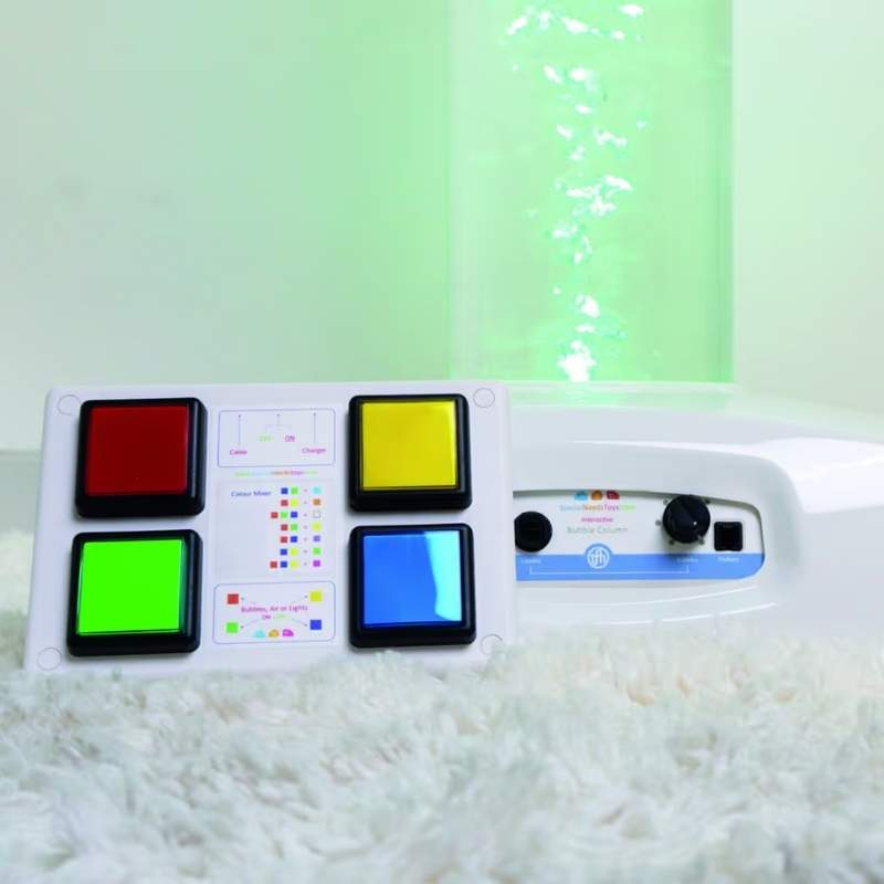 Close-up of the TFH Wireless Bubble Tube colour controller with a green-lit bubble tube glowing behind it