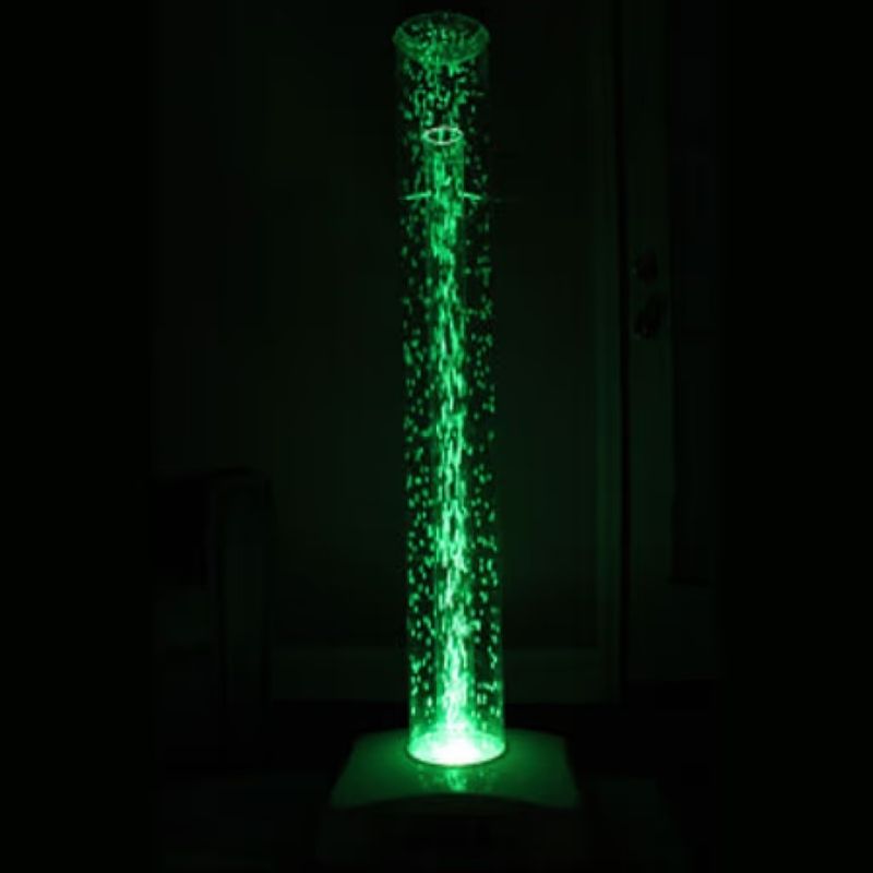 TFH Wireless Hurricane Tube standing on its base in a darkened room, showing the full 48 inch waterless bubble tube glowing green