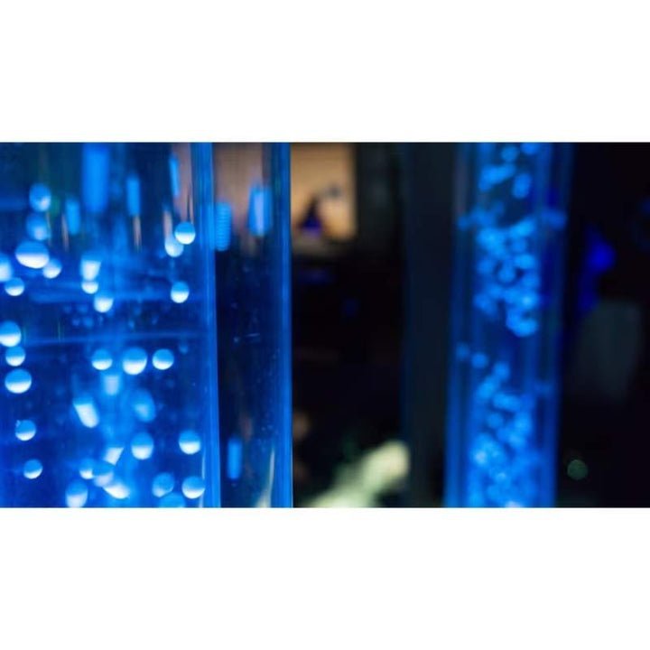Two TFH Wireless Hurricane Tubes side by side glowing blue, showing the sensory bubble effect of this waterless light