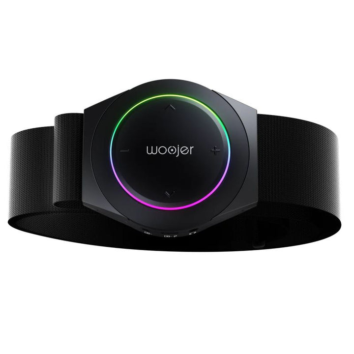 Woojer Strap 4 vibroacoustic wearable seen from the front on its adjustable strap, a compact haptic audio device for home, classroom and therapy room use